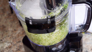 Shredding brussels sprouts in a food processor.