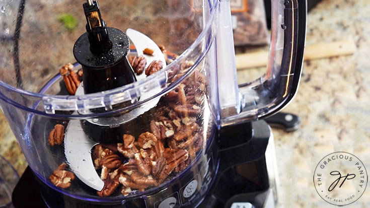 Chopping pecans in a food processor.