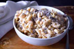 Just cooked Creamy Garlic Mushroom Pasta in a white bowl, ready to eat.
