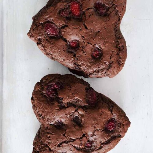 Two just-baked Healthy Chocolate Raspberry Cakes from overhead.