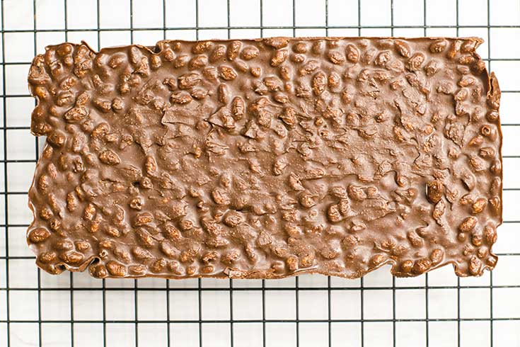 The chilled Homemade Crunch Bars loaf removed from the baking pan and placed on a wire rack.