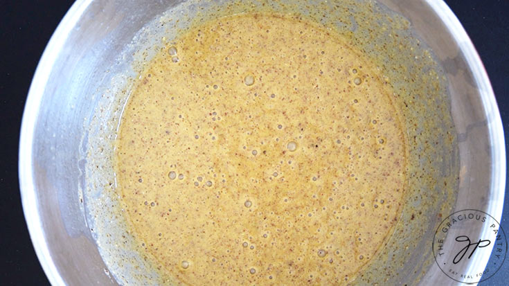 Pecan Butter Bread batter sitting in a mixing bowl.