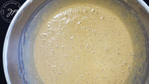 Healthy Apple Ring Pancake batter in a mixing bowl.