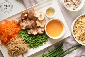 Healthy Pork Fried Rice Recipe ingredients gathered together on a white surface.