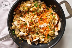 Healthy Pork Fried Rice Recipe ingredients cooking in a wok.