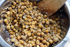 All the Roasted Everything Bagel Chickpeas ingredients mixed together in a mixing bowl