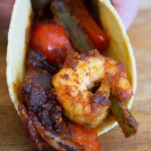 A closeup of a folded Sheet Pan Shrimp Fajita.