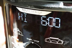 A slow cooker display panel shows that it is set to high temperature for six hours.