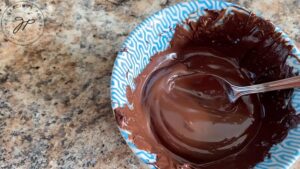 Fully melted chocolate in a small bowl.