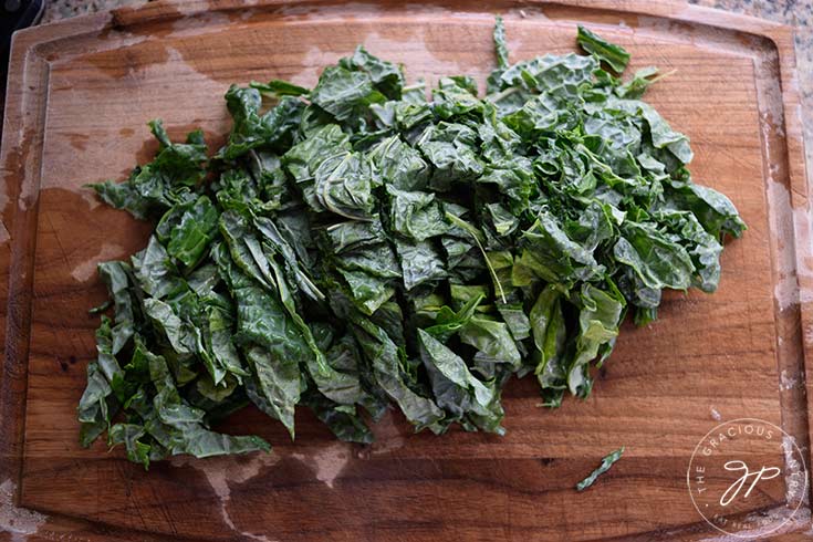 Chopped kale laying on a cutting board.