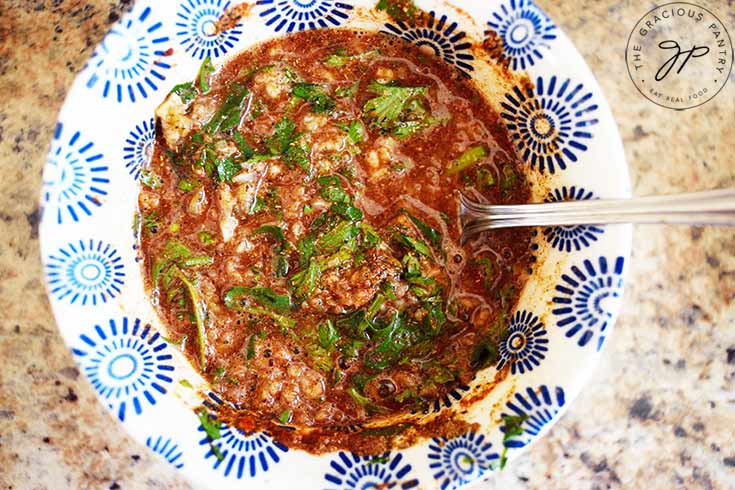 Slow Cooker Cilantro Lime Chicken sauce mixed in a small mixing bowl.