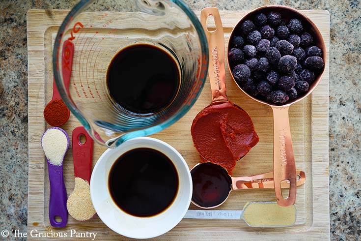 Blueberry BBQ Sauce Recipe ingredient gathered on a cutting board.