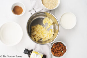 Bananas mashed in the bottom of a pot.