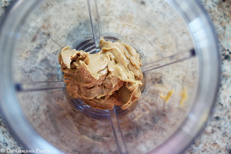 Peanut butter in a blender tumbler.