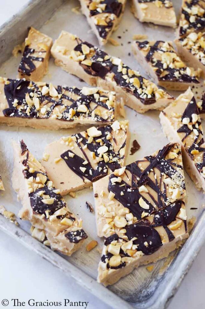 Pieces of Chocolate Peanut Butter Frozen Yogurt Bark on a cookie sheet.