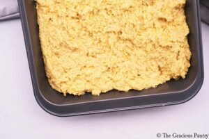 Cornbread dough in a baking pan.