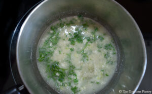Melted garlic butter in a sauce pot.