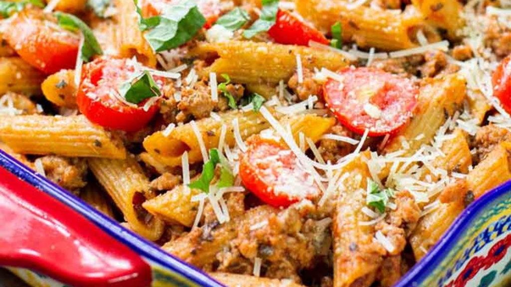 A closeup of baked ziti pasta.