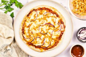 Just-baked BBQ Chicken Pizza cooling on a plate.