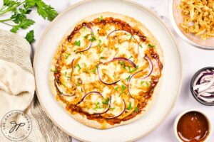 Parsley sprinkled over the top of the BBQ Chicken Pizza for garnish.