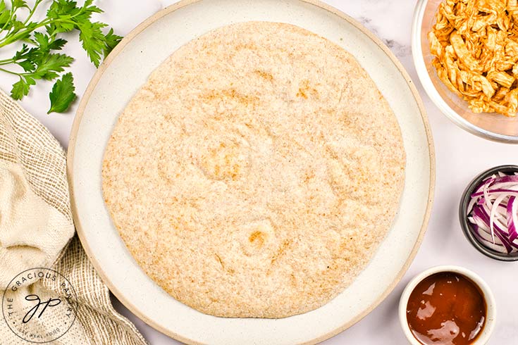 A pita bread laying on a plate.