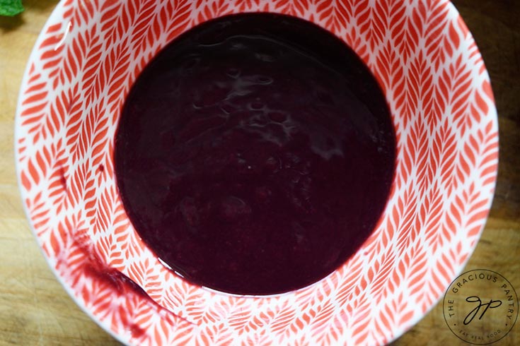 Strained blackberry juice in a bowl.