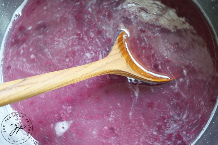 Stirring the Blueberry Lemonade liquids together in a large mixing bowl.