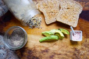 An overhead view of all the ingredients needed for this Everything Bagel Avocado Toast recipe.