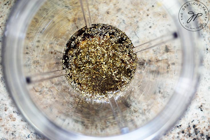 All the Healthy Balsamic Vinaigrette recipe ingredients in a blender tumbler.