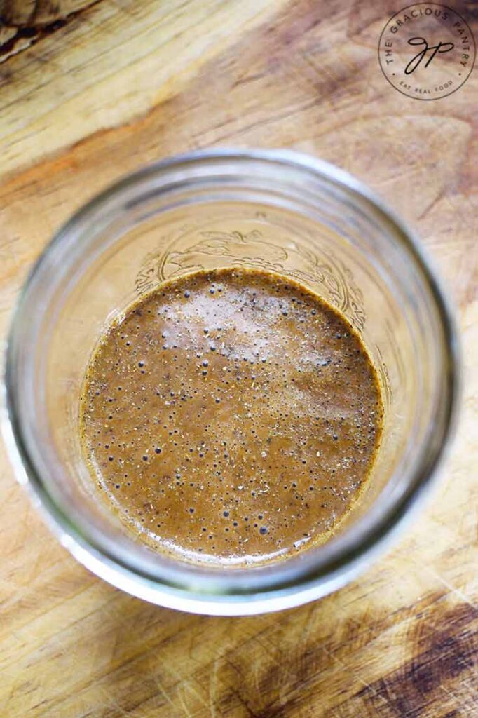 Looking down into a mason jar partially full of this Healthy Balsamic Vinaigrette Recipe