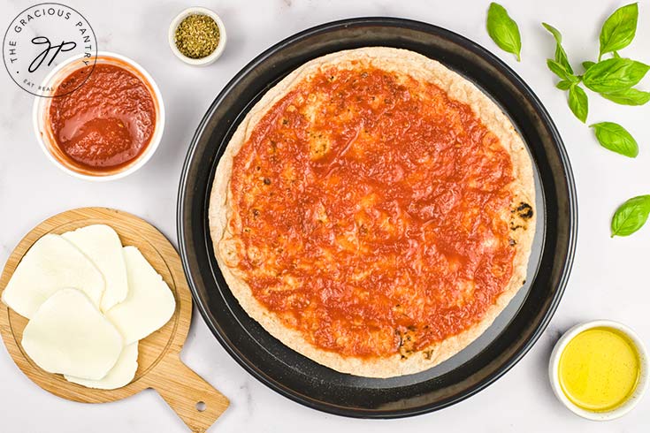 Tomato sauce smeared on a pita bread.