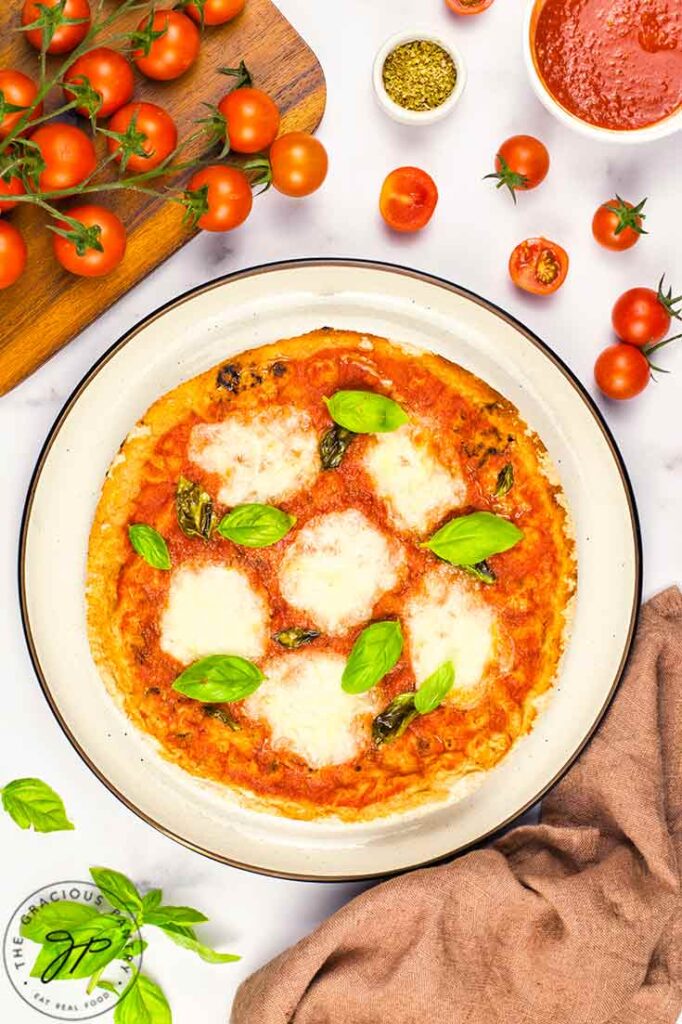 A Margherita Pizza served on a platter.