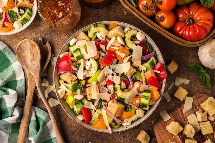 An overhead view of a plat filled with panzanella salad.