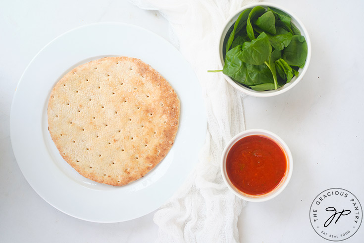 A pita bread placed on a white plate.