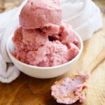 An angled view of a small white bowl filled with Strawberry N'ice Cream.