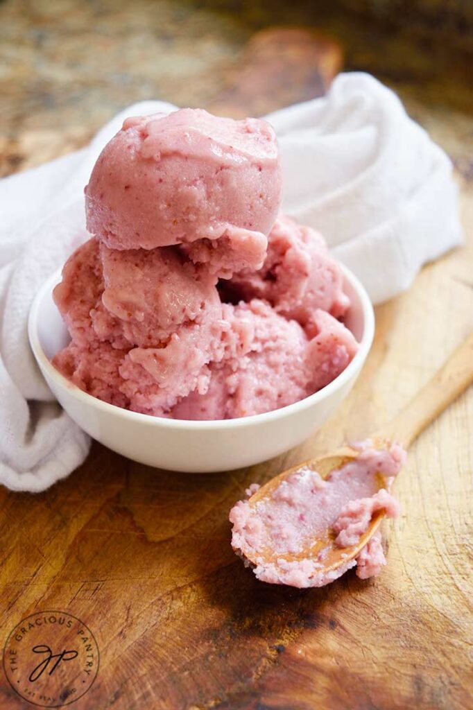 An angled view of a small white bowl filled with Strawberry N'ice Cream.