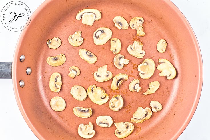 Cooked mushrooms in a skillet.