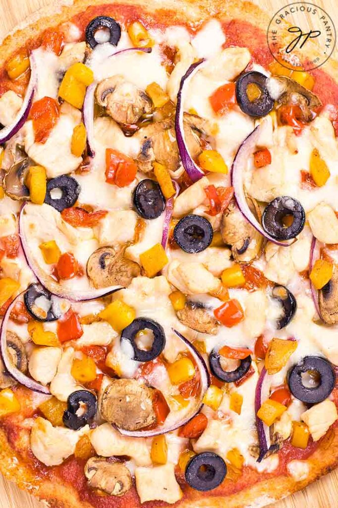 An overhead closeup of a Supreme Pizza.