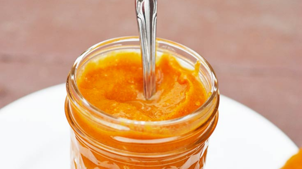 A closeup of a jar of sweet potato butter.