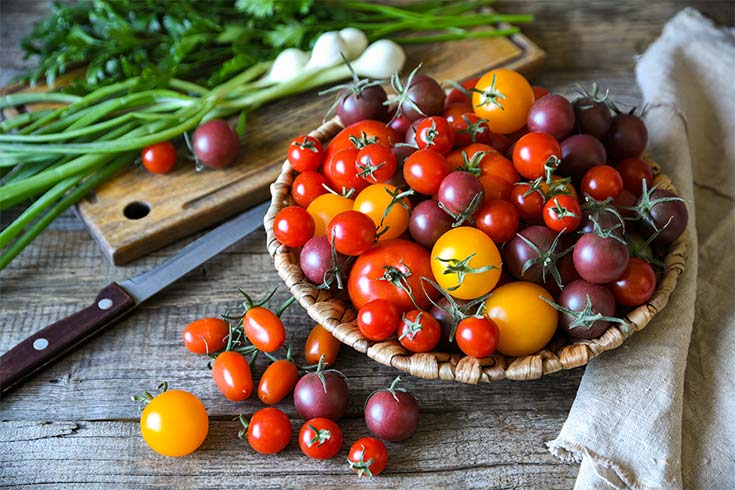 A platter of small grape and cherry tomatoes.
