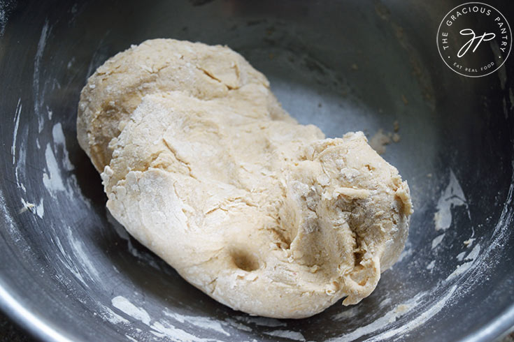 Whole Wheat Focaccia Bread dough in a bowl. The dough is too dry and firm.