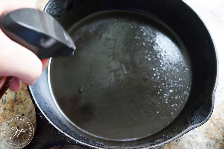 Greasing a cast iron skillet.