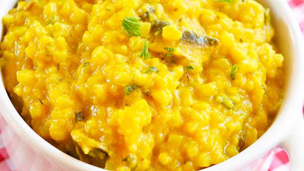 Closeup of butternut squash risotto in a white bowl.