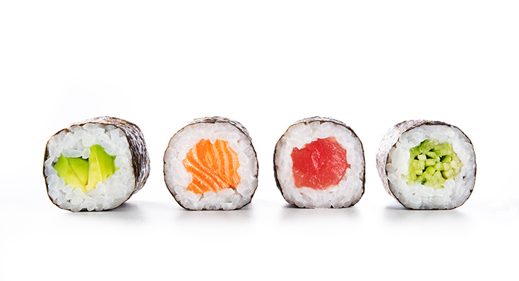 A row of sushi on a white background.