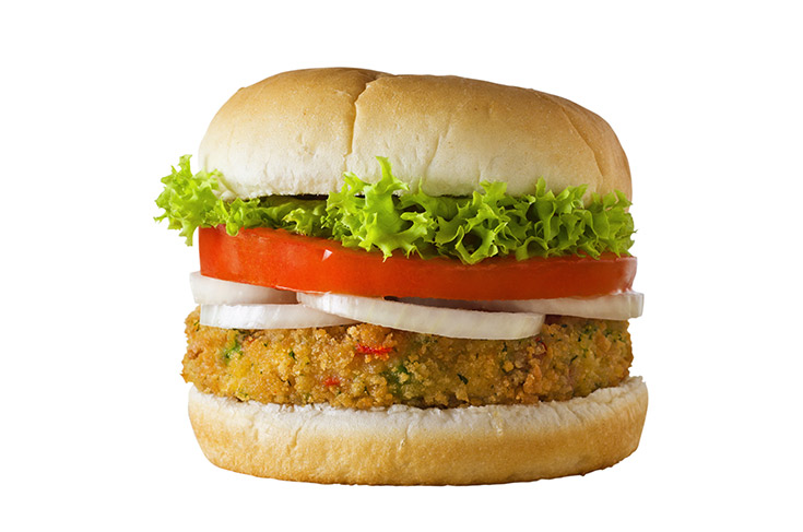 A veggie burger on a white background.