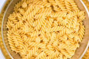 Cooked pasta strained in a colander.