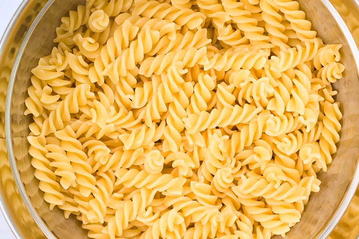 Cooked pasta strained in a colander.