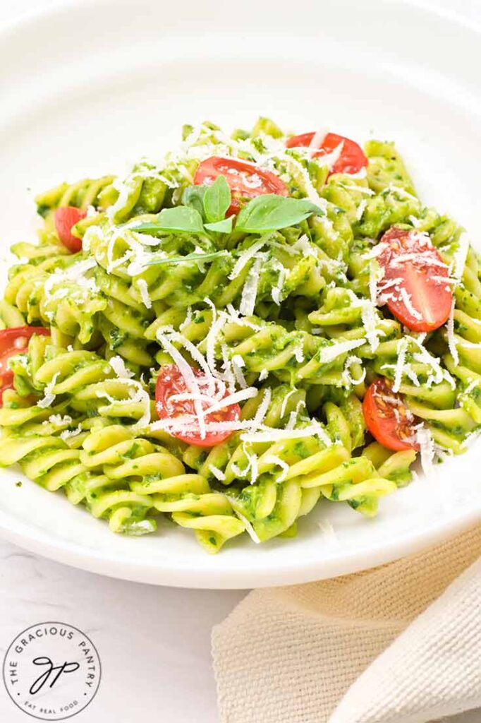 A closeup of a white bowl filled with Avocado Pasta.