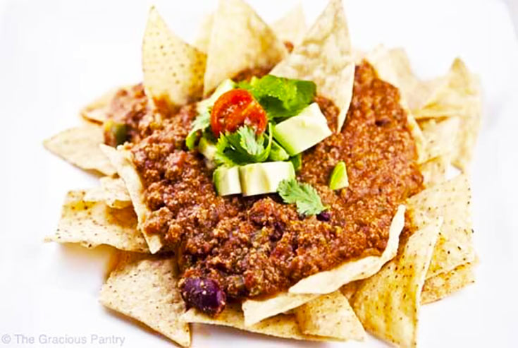 Chili nachos on a white background.