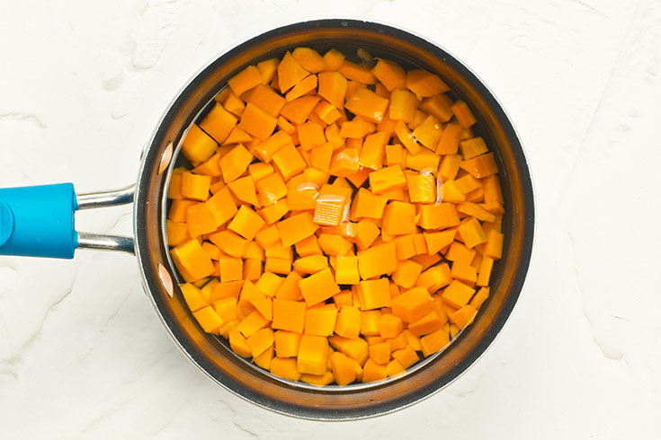 Carrots cooking in a pot.